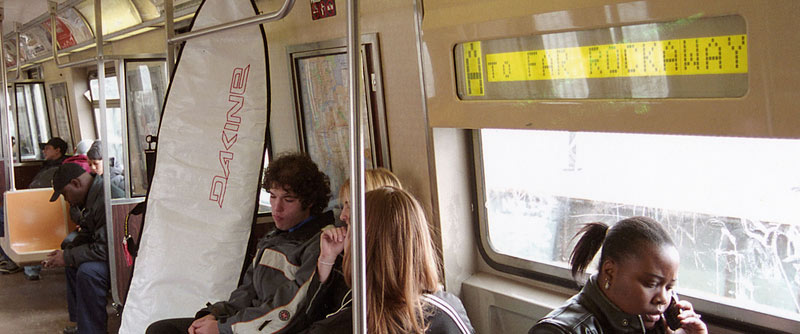 Domenech Asbun and Chamile Achwald relax in the midst of a one-hour commute from Manhattan to the beaches of Rockaway, in Queens. March 26, 2006. PHOTO: Carl Critz.