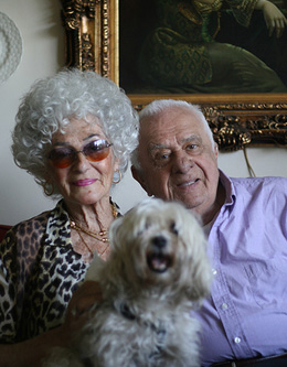 “He lives the life of a king!” says Bev Hauser of her husband, Sam, here with shi-tzu/poodle Buddy in their apartment near Eighth Avenue.  Photo by Eric Markowitz