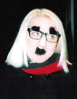 Kerry fought cancer with her sense of humor. The year she was diagnosed, she painted her head white and her eye sockets black; made a sickle from a broom handle; and went to a Halloween dance in her wheelchair, as Death. Here she is in another disguise.
Photo courtesy of the Banik family