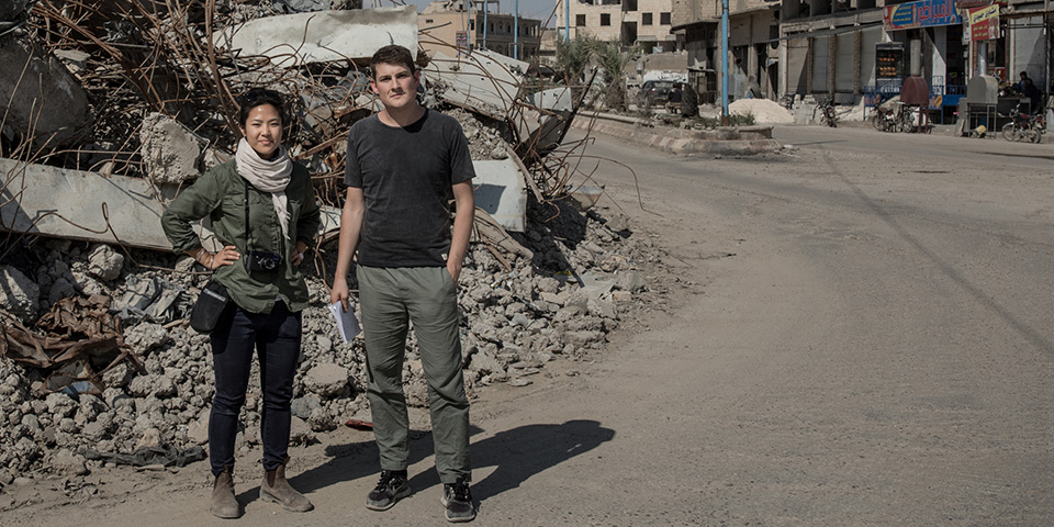 Two journalists on a street