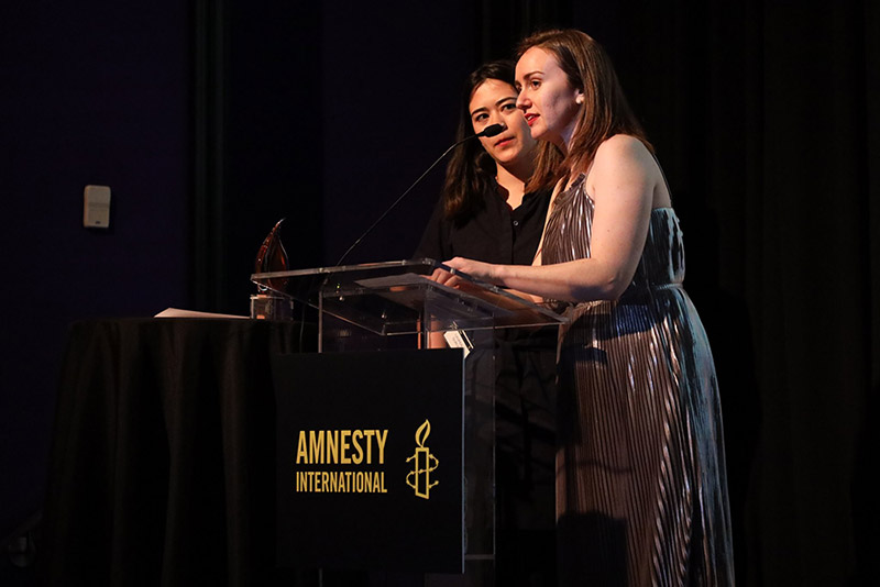 Claire Tighe and Lauren Gurley accept their Amnesty International Award