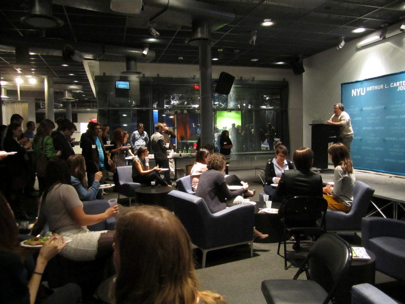 Dan Fagin at podium during an event