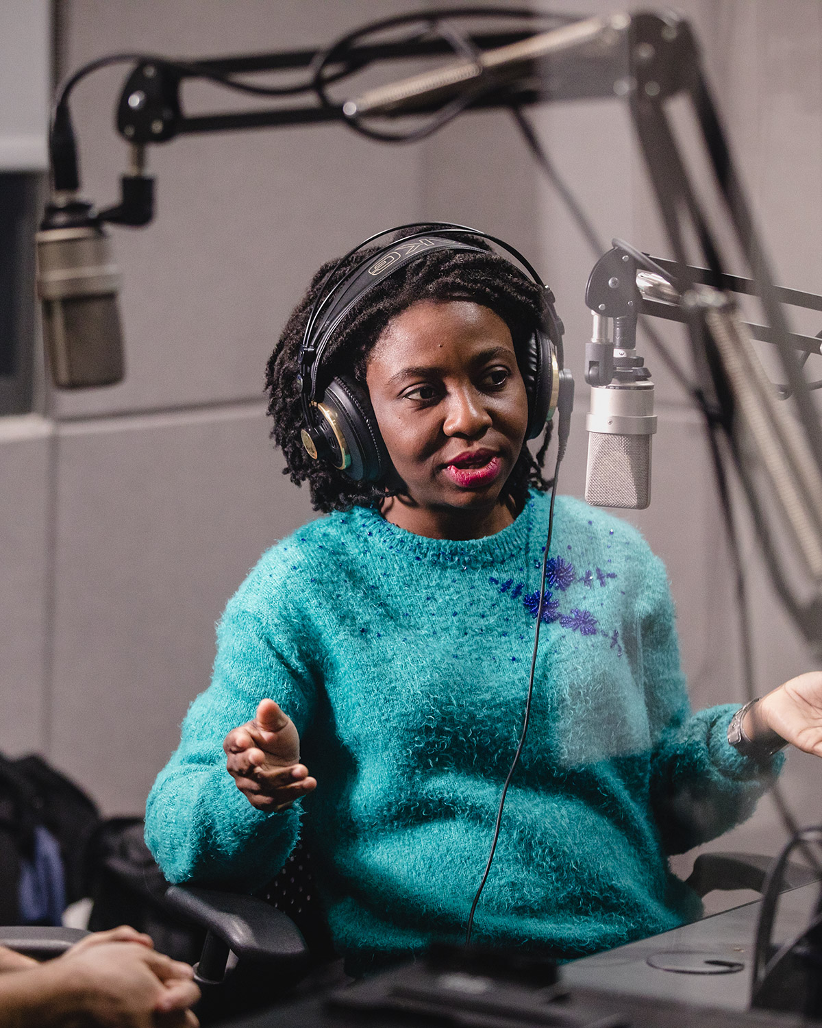 Student at microphone in recording studio