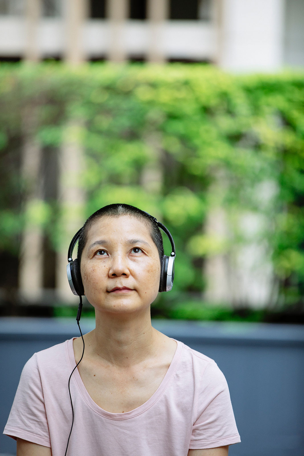 Woman enjoying music in headphone in park